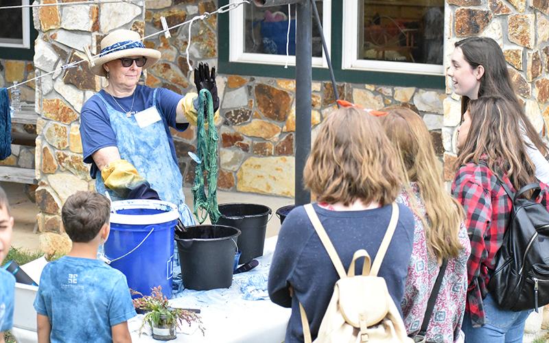 Salley Blackenship demonstrates indigo dying for the Fall Festival patrons.