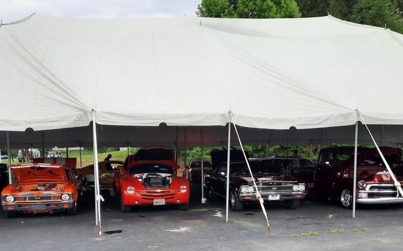 Cars under the big tent provided shade for those checking out the classics during the first car show at Valley River Chevrolet on July 15.