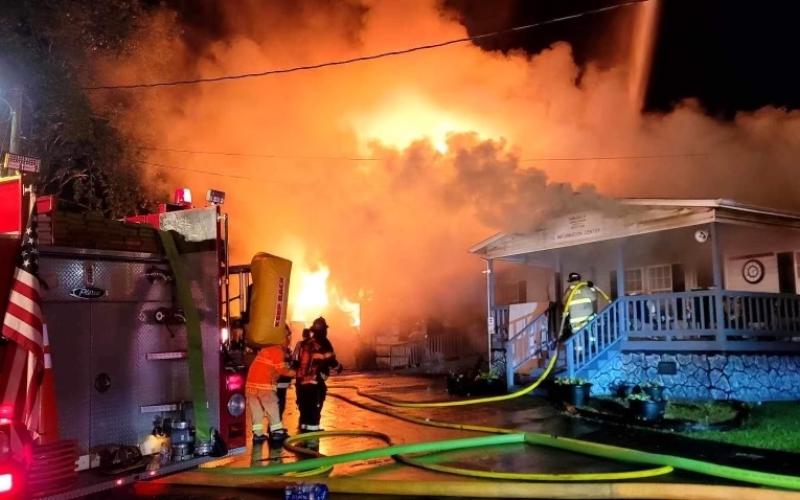 Firefighters from Andrews, Murphy and Peachtree battle a blaze at 52 Robbinsville Road on July 23. Photo by Robert Graf/Valleytown Fire & Rescue