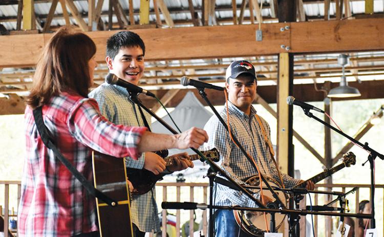 The Jones Brothers Band, featuring (from left) Betsy Blankenship, Joshua Jones and Johnathan Jones, played for the assembled guests at the Fall Festival in Brasstown over the weekend.