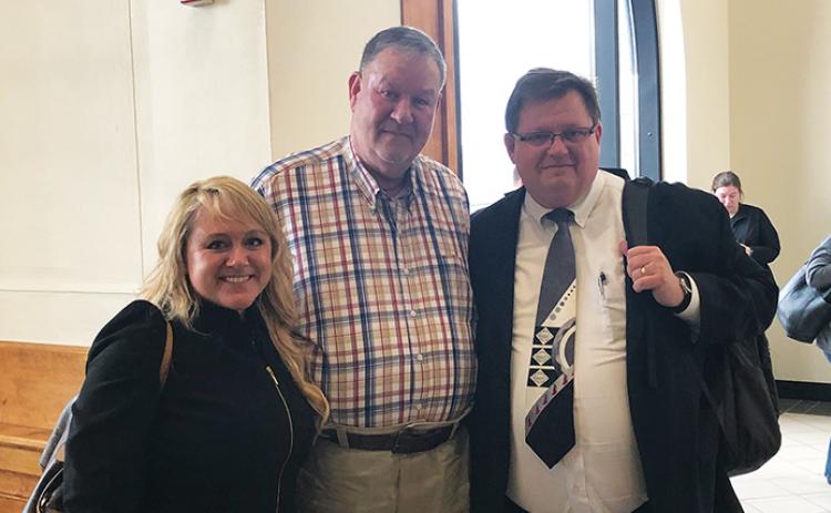 Daniel Hughes (center) and his defense attorneys, Holly Christy and Rich Cassady, following the “not guilty” verdict Thursday at the Cherokee County Courthouse. Photo by Penny Ray