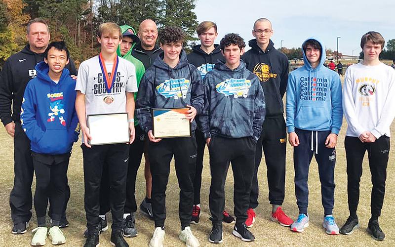 The Murphy boys cross-country team poses after their third-place performance at the state meet. Team members are (front row, from left) Richard Ly, Caleb Jones, Chase Pierce, Andrew Bryson; Back row are (from left) coach Davis Bryant, Clayton Laney, coach Frank Hill, Christian Tighe, Michael White, Caleb Rice and Tanner Roberts. Photo courtesy of Murphy High School