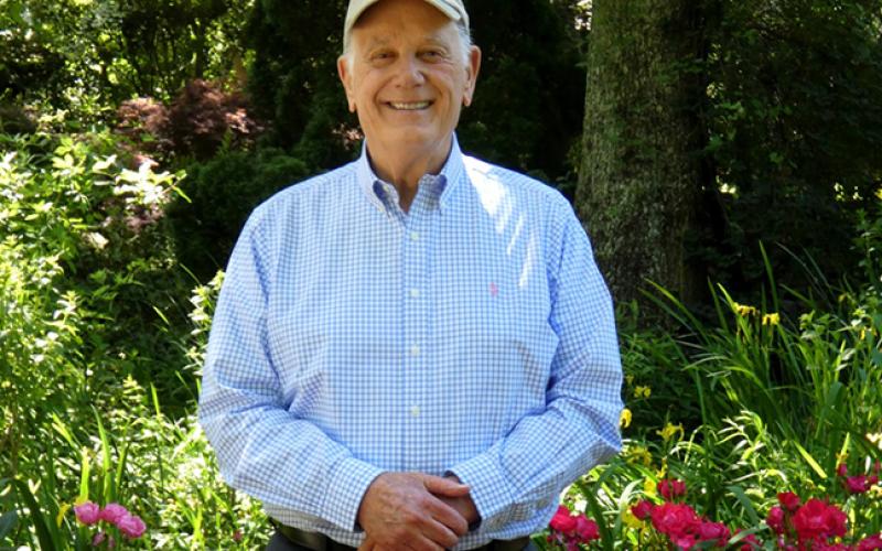 Murphy native Jim Gibbs stands among his 376-acre Gibbs Gardens, which won the National Award for Garden of Excellence in 2019.