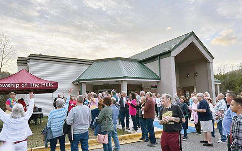Ivelisse Miranda-Wilson/Contributing Photographer  Folks of faith gathered for prayer in the parking lot of Blairsville Cinema last week prior to viewing the movie Jesus Revolution.