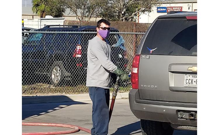 Local driver Allen Crisp fills a Frito-Lay employee’s vehicle in Pharr, Texas.