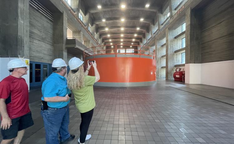 Civilians take pictures of electric generators during a tour of Fontana Dam on July 28. 
