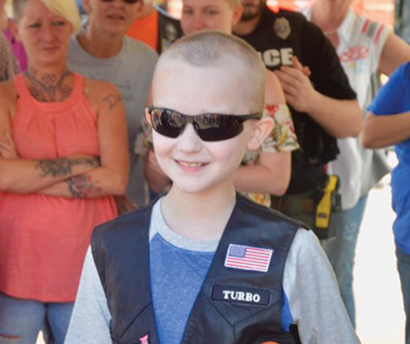 Danner Cochran was presented with his own biker vest. Photo by Bill "Gator" Shilling