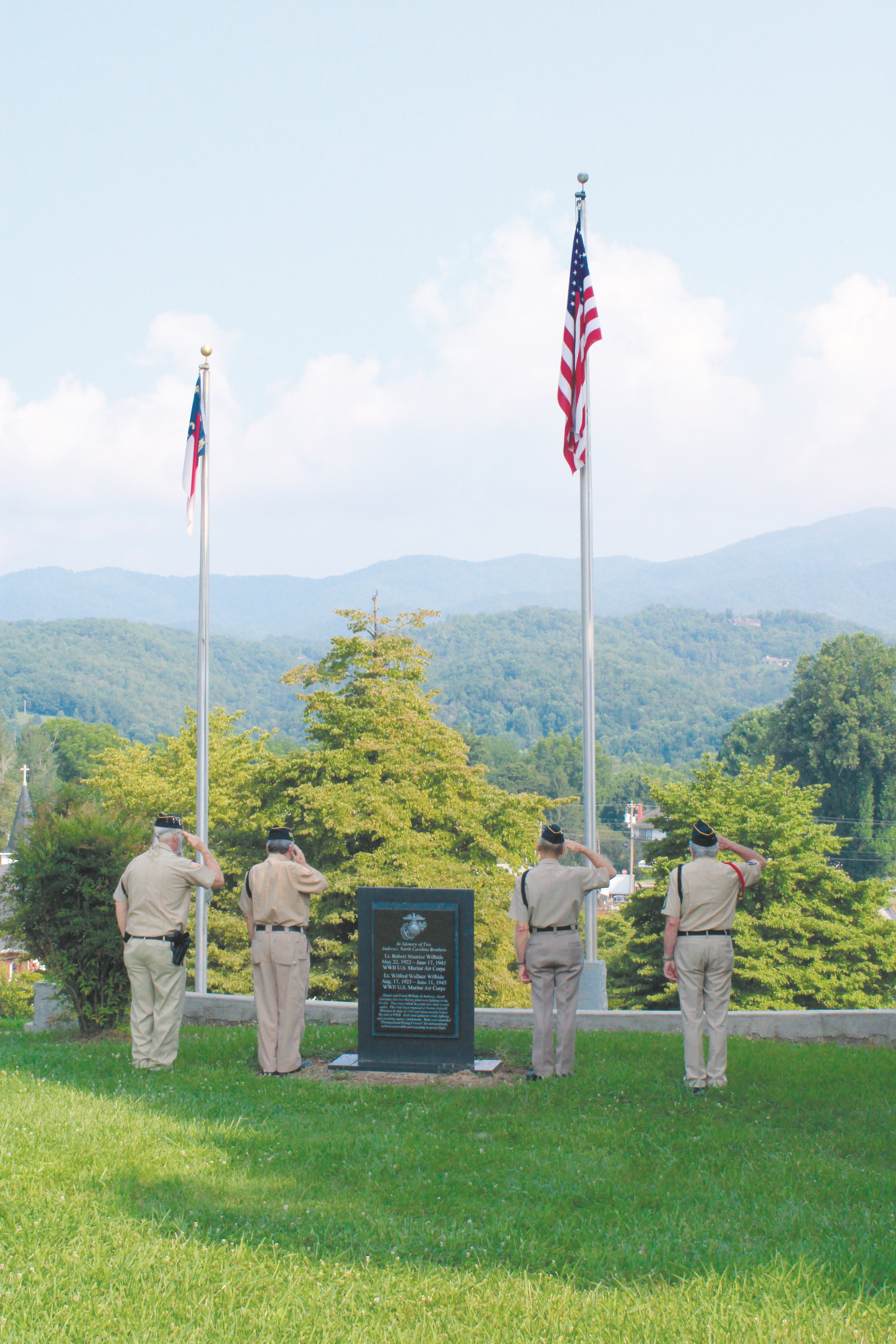 American Legion Post 96 members Barry Fry, Art West, Rich Silva and Rich Le Count salute the flag during the Pledge of Allegiance at the dedication ceremony for the Freedom Memorial Plaza on Friday. 