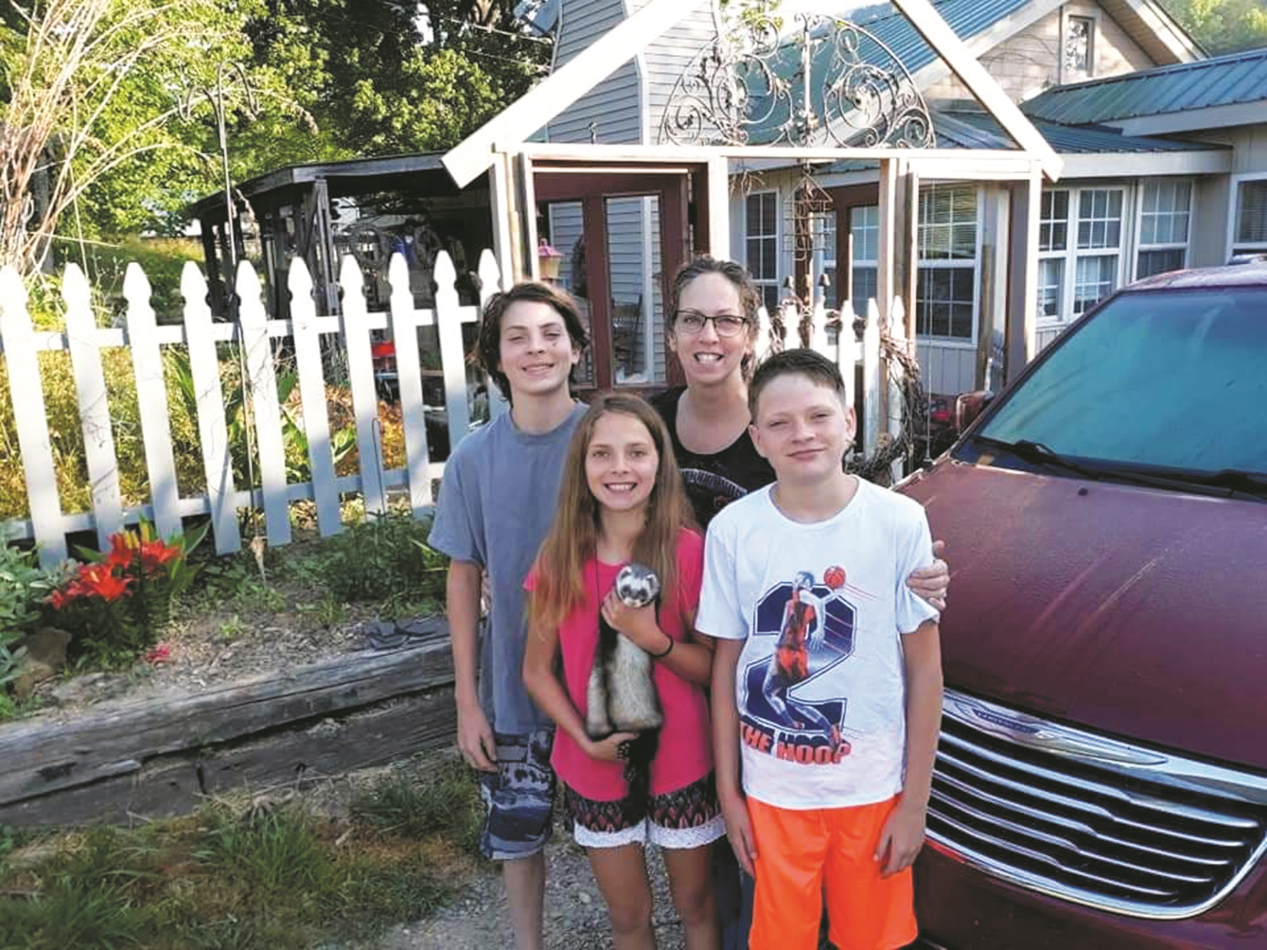Angela Morris of Blairsville, Ga., with her three children – Michael, 15; Isaac, 14; and Caroline, 11; lost their home Sunday in an accidental explosion. All the children attend The Learning Center charter school in Murphy.