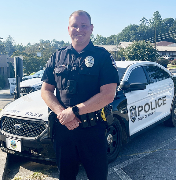 Cody Williams poses outside the Murphy Police Department downtown. Williams became a town police officer on Aug. 10 after nearly a decade of  experience with the  Cherokee County Sheriff’s Office.