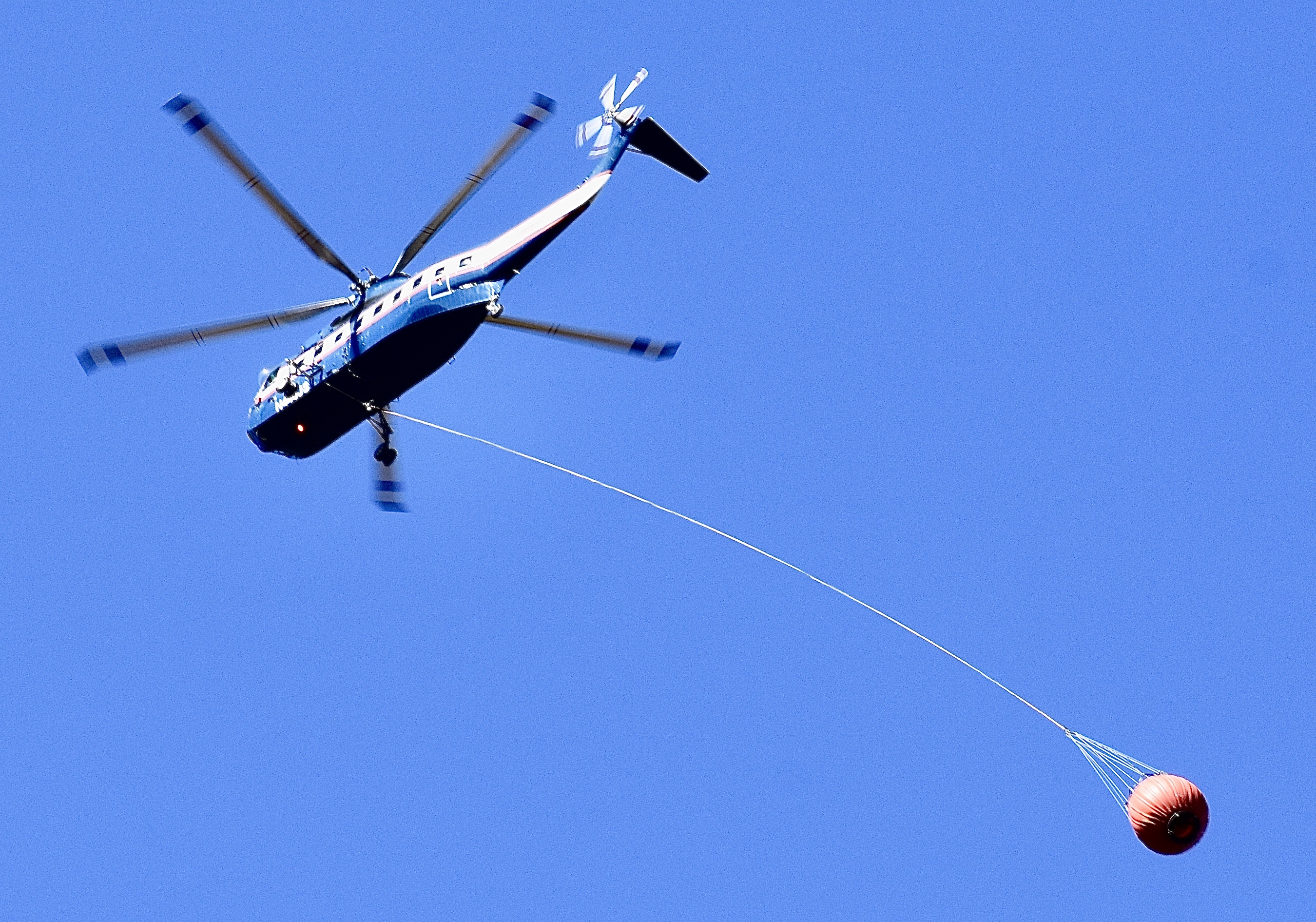 Helicopter returns for water after an air drop on Wednesday. 