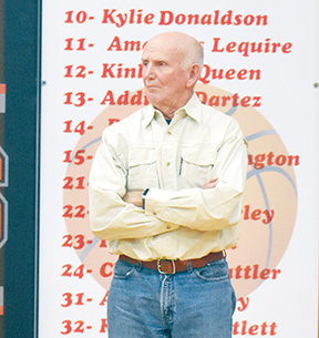 Ken Solesbee (right) looks on during the No. 15 jersey retirement ceremony for Dr. Gary Roper at Andrews High School on Jan. 27. The gym bears Solesbee’s name.