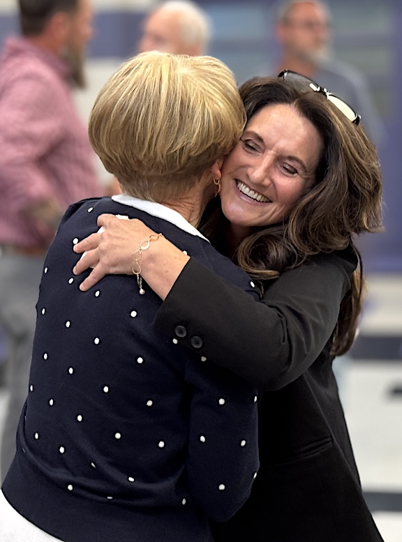 School Board Member Jeannie Gaddis, left, congratulates Angel Owens after her appointment to be Cherokee County Schools superintendent.
