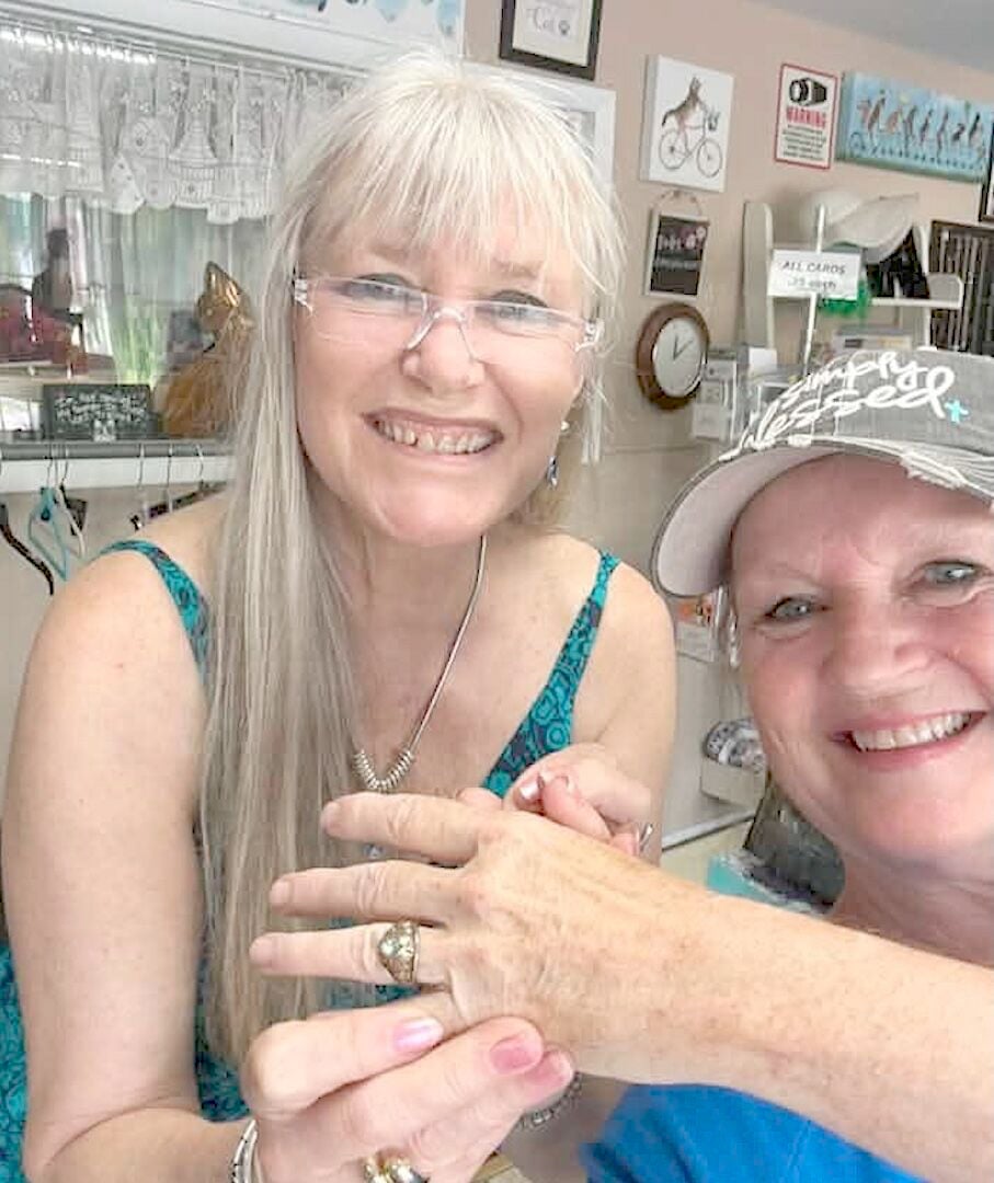 A chance discovery led to a happy reunion as Lisa Pursel, left, a cashier for 25 years, presents a long-lost class ring to its original owner, Veronica Flood. The ring, found among donated items at the Valley River Humane Society Thrift Store, is once again where it belongs. Photo contributed by Veronica Flood