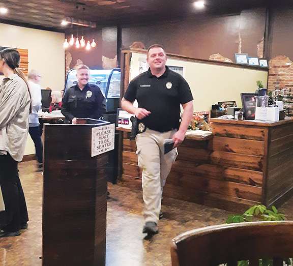 Assistant Chief Ryan Cunningham with the Murphy Police Department was happy to have a stack of sold raffle tickets at Legends Steakhouse in downtown Murphy, Thursday evening. The money collected will go towards the annual Shop with a Cop program slated for Saturday, Dec. 14. Officer Parker Southard looks on with a smile after the two perused the dining room looking for folks wanting to give to the cause. Legends Steakhouse donated 10% of the meal proceeds for the evening to Shop with a Cop. Donations are still be accepted at Murphy Police Department located at 498 Hill Street. Donations are tax deductible.