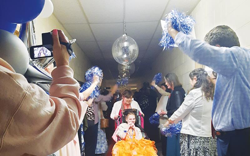 Photos by Anngee Quinones-Belian/Staff Correspondent  Kelsey Shaw appeared to feel the love of family and friends as she moved along the red carpet towards the party. Balloons, waving pompoms and cheers awaited each guest as they approached their grand entrance into the main event.
