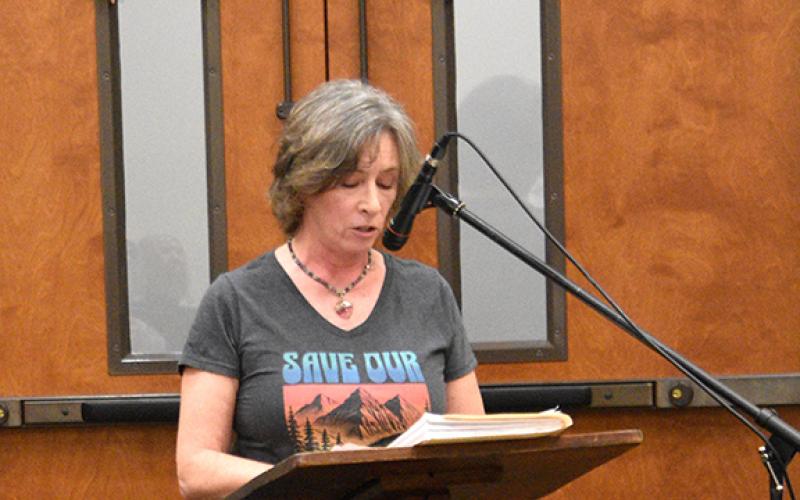 Randy Foster/editor@cherokeescout.com Cherokee County resident Katherine Taaffe gives remarks ahead of presenting a petition to Cherokee County commissioners calling for them to protect public lands from private development at Monday night’s board of commissioners meeting.