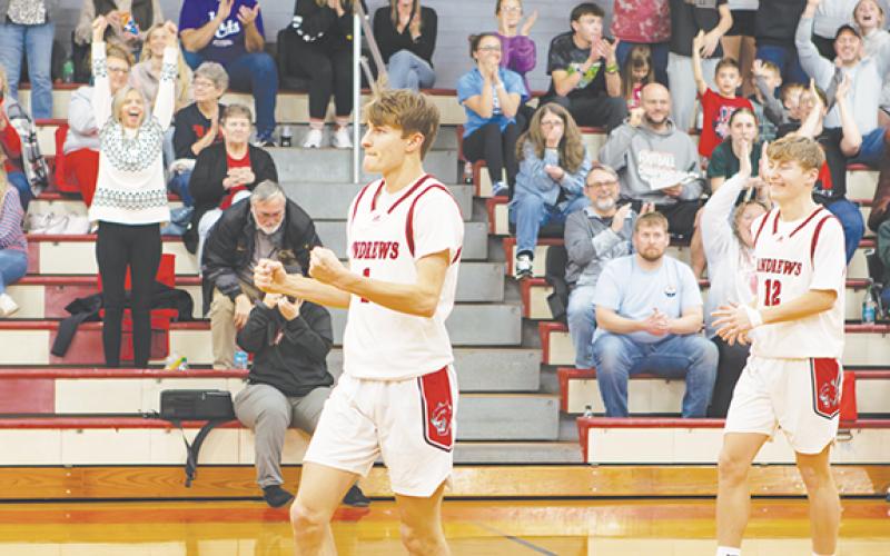 Cannon Crompton/sports@cherokeescout.com Andrews junior Gabe Clark celebrates after draining a shot for the 1,000th point in his high school basketball career. Clark scored 11 seconds into the game on Feb. 11. The last Wildcat to reach the 1,000-point milestone was Gabe’s brother, Ty Clark, who achieved it during his senior year last season.