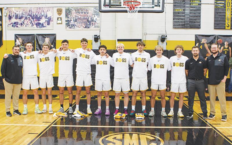 Cannon Crompton/sports@cherokeescout.com Murphy High School honored its senior boys basketball players on Feb. 4. From left are assistant coach Michael Kernea, Camden Breazeale, Kyle Luke, Elijah Twiggs, Abram Twiggs, McKinnley Dockery, Aaron Harger, Cale Harger, Ryan Payne, Tyler Payne, head coach Heath Curtis and assistant coach Cody Allen.