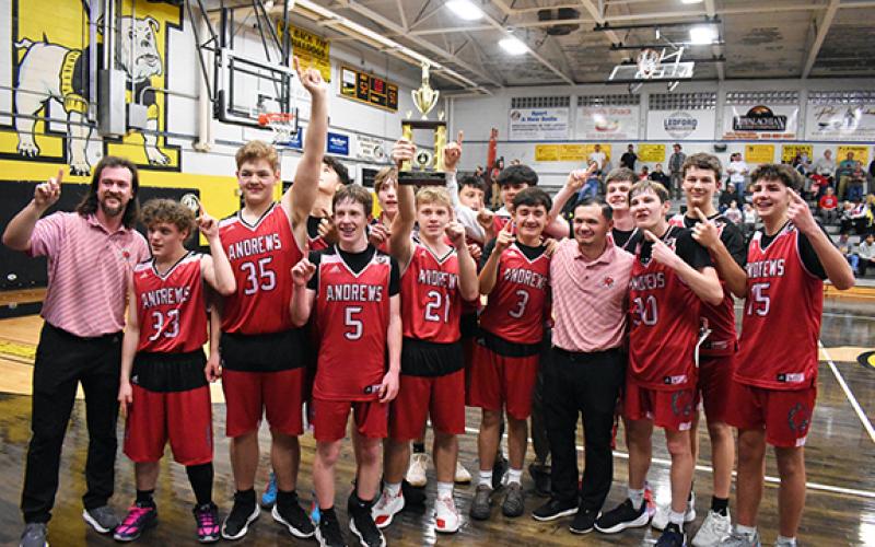 Kevin Hensley/The Graham Star The Andrews JV boys basketball claimed the Big Smoky Mountain Conference championship on Thursday night. Front row (from left): assistant coach Matt Maennle, Carson Taylor, Brayden Helton, Jayce Donaldson, Korbin Hicks, Sebastian Jimenez, head coach Eric Duong, Luke Clark and Jed Davis. Back row (from left): Cade Parker, Malachi Bateman, Parker Mabry, Alex Garrett, Dawson Stalcup and Logan Hyde.