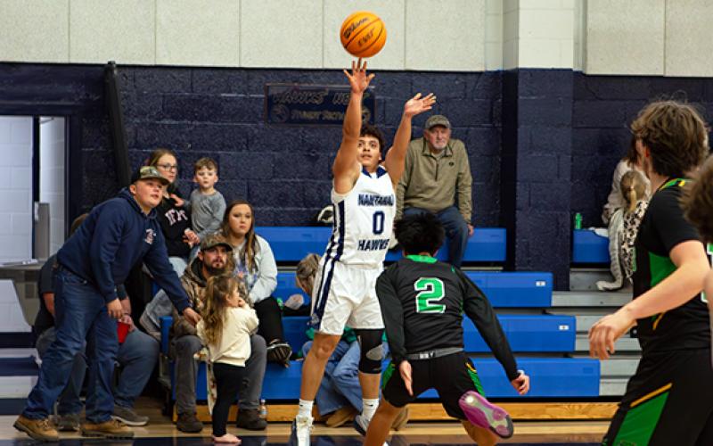 Cannon Crompton/sports@cherokeescout.com Fernando Trejo of Nantahala shoots a 3-pointer against Blue Ridge Early College on Jan. 29.