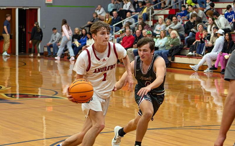 Cannon Crompton/sports@cherokeescout.com Gabe Clark of Andrews drives to the hoop against Swain County on Friday.