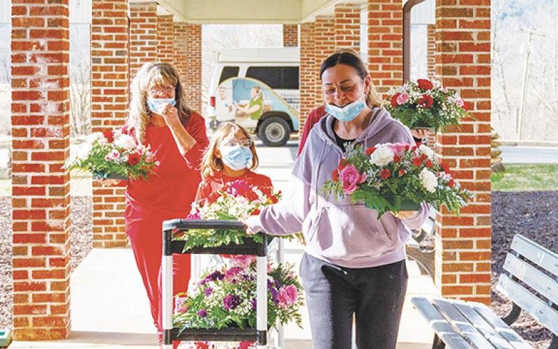 Photos by Michelle Bradbeer/Staff Correspondent Andrews Florist brought colorful flowers to Valley View Care &amp; Rehabilitation Center on Friday after masking up due to COVID and flu outbreak at the facility. Thanks to local residents making generous donations, 12 special tabletop flower arrangements and five vases were delivered to staff and patients Friday. Florist Christy Reeves and assistants Eloise Mason, Bethony Allen and Keyari Allen decorated the cafeteria and recreation room for patients, while the n