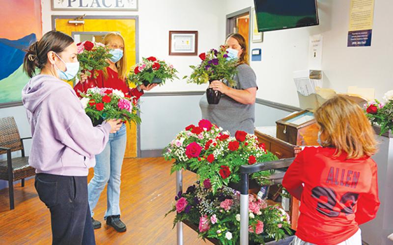 Photos by Michelle Bradbeer/Staff Correspondent Andrews Florist brought colorful flowers to Valley View Care &amp; Rehabilitation Center on Friday after masking up due to COVID and flu outbreak at the facility. Thanks to local residents making generous donations, 12 special tabletop flower arrangements and five vases were delivered to staff and patients Friday. Florist Christy Reeves and assistants Eloise Mason, Bethony Allen and Keyari Allen decorated the cafeteria and recreation room for patients, while the n