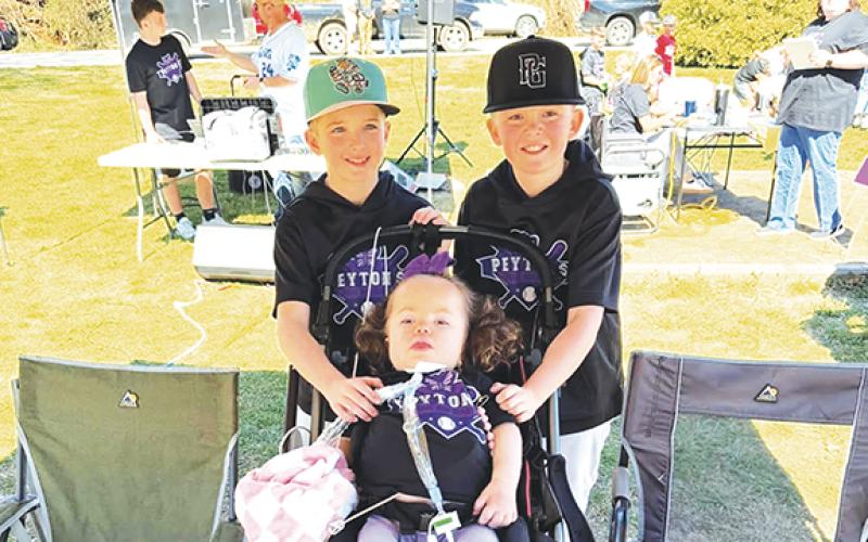 Photos by Aiden McCoy Williams/Staff Correspondent Peyton Mixon (middle) was able to attend the Home Run Derby held Saturday to raise funds for her and her family.