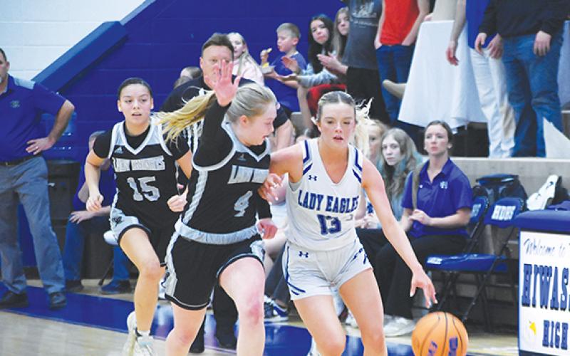 Lexie Anderson/The Graham Star Brooklyn Orton of Hiwassee Dam dribbles down the court against Robbinsville on Monday night.