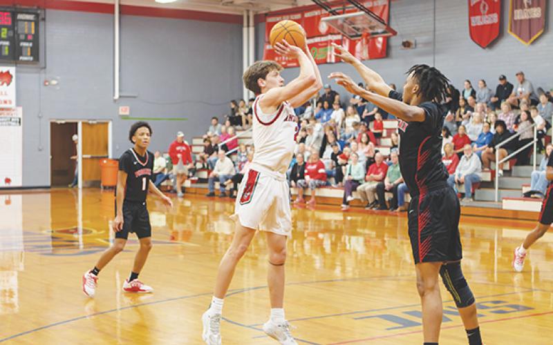 Cannon Crompton/sports@cherokeescout.com Logan Shuler of Andrews hits a jump shot against Winston-Salem Preparatory Academy on Saturday.