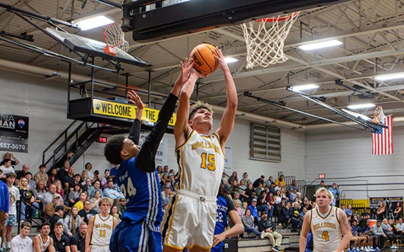 Cannon Crompton/sports@cherokeescout.com Abram Twiggs of Murphy fights past an Albemarle defender to make a shot Thursday night.