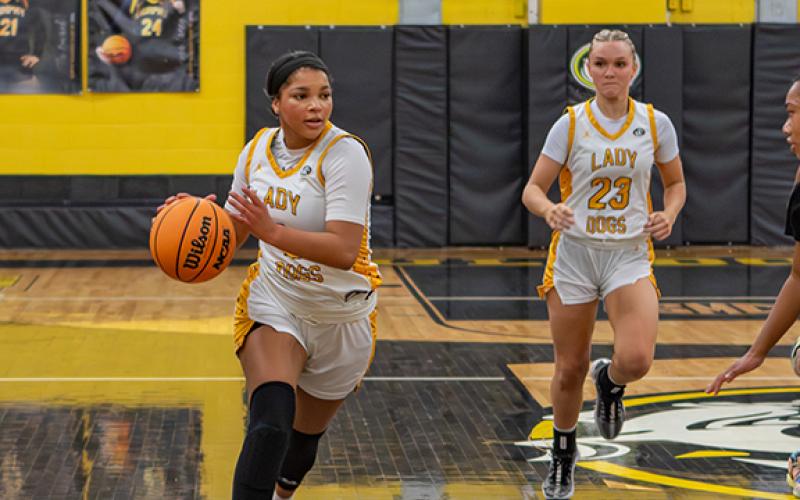Cannon Crompton/sports@cherokeescout.com Ilie Smith of Murphy dribbles the ball down the court against Highland Tech on Thursday.
