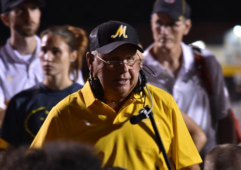 Bulldogs head coach David Gentry speaks to his players after their season-opening win over Pisgah. Photo by Noah Shatzer