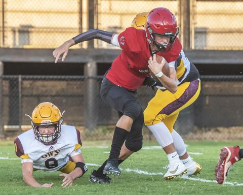 Andrews' Tucker Holloway, shown running against Cherokee last week, threw a touchdown pass against Trinity on Friday night. Photo by Byron Housley