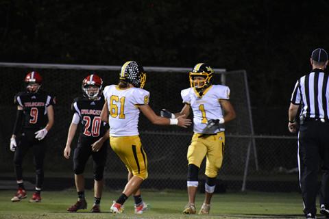Murphy's Abram Abling (1) and Parker Posey (61) celebrate Abling's first career touchdown in the Bulldogs' win over Andrews. 