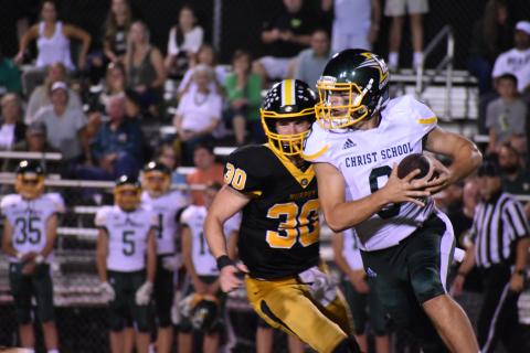 Murphy's Chander Wood chases Christ School quarterback Navy Shuler.