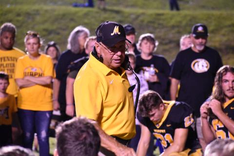 Coach Gentry speaks to his players following the Bulldogs' loss to Christ School Friday night.