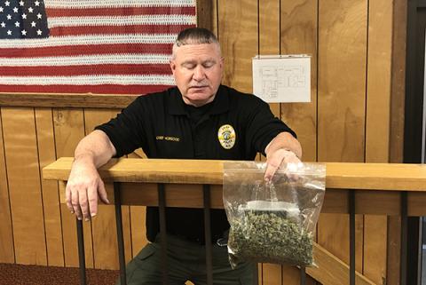 Andrews Police Chief Michael Hobgood holds a bag of marijuana seized Thursday.
