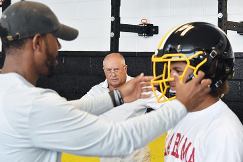 Murphy’s Justice  Dorsey gets fitted for a Zero1 helmet as head coach David Gentry looks on last week. Photo by Noah Shatzer