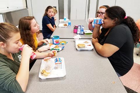 Faith Thompson, Allison Derreberry, Emma Johnson, Grace Lyn Hughes and Kaniya Teesateskie enjoy lunch at Murphy Middle School. Photo by Samantha Sinclair