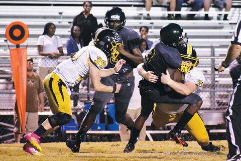 Murphy’s Dallas Rayburn lays a big hit on a Life Christian runner during Friday night’s non-conference game. Rayburn had three sacks overall.