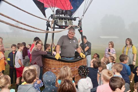 Tom Lattin shows local kids how to operate the Re/Max balloon in a demonstration Monday morning. Photo by Autumn Ritz
