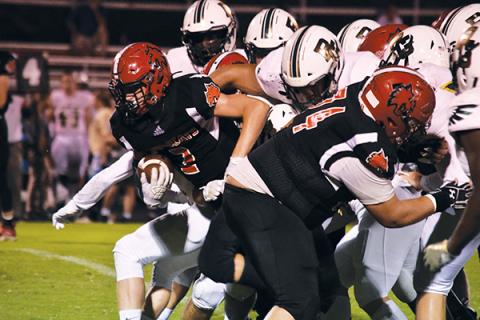 Andrews’ Landon White pops out of the pack on a fourth-down run to convert during Friday’s game against Rabun Gap.