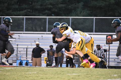 Chandler Wood, Colby Stalcup and Dallas Rayburn team up for the stop in Murphy's 45-28 victory.