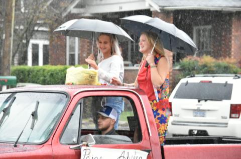 Last year's Andrews queens Alyssa Messer and Paige Lindley brave the rain on the back of a truck.