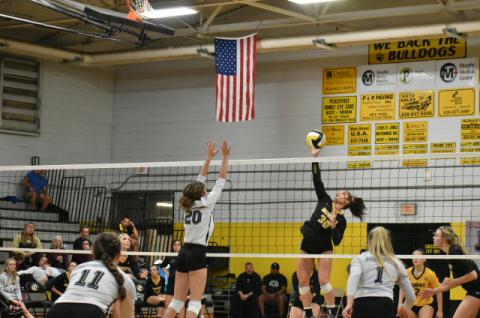 Murphy's Grace Nelson rises for a hit in the SMC Championship match.