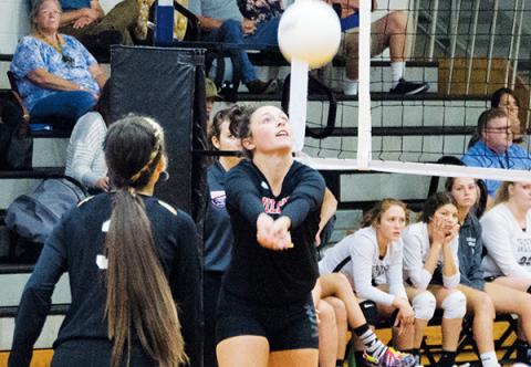 Andrews' Abby Hedden sets the ball for the Lady Wildcats against Robbinsville last week. Photo by Kevin Hensley