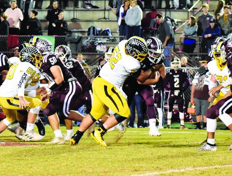 Murphy lineman Colby Stalcup records one of his two sacks Friday night during the Bulldogs’ first win against the Swain Maroon Devils in Bryson City since 2005. Photo by Noah Shatzer
