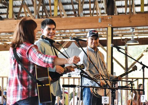 The Jones Brothers Band, featuring (from left) Betsy Blankenship, Joshua Jones and Johnathan Jones, played for the assembled guests at the Fall Festival in Brasstown over the weekend.